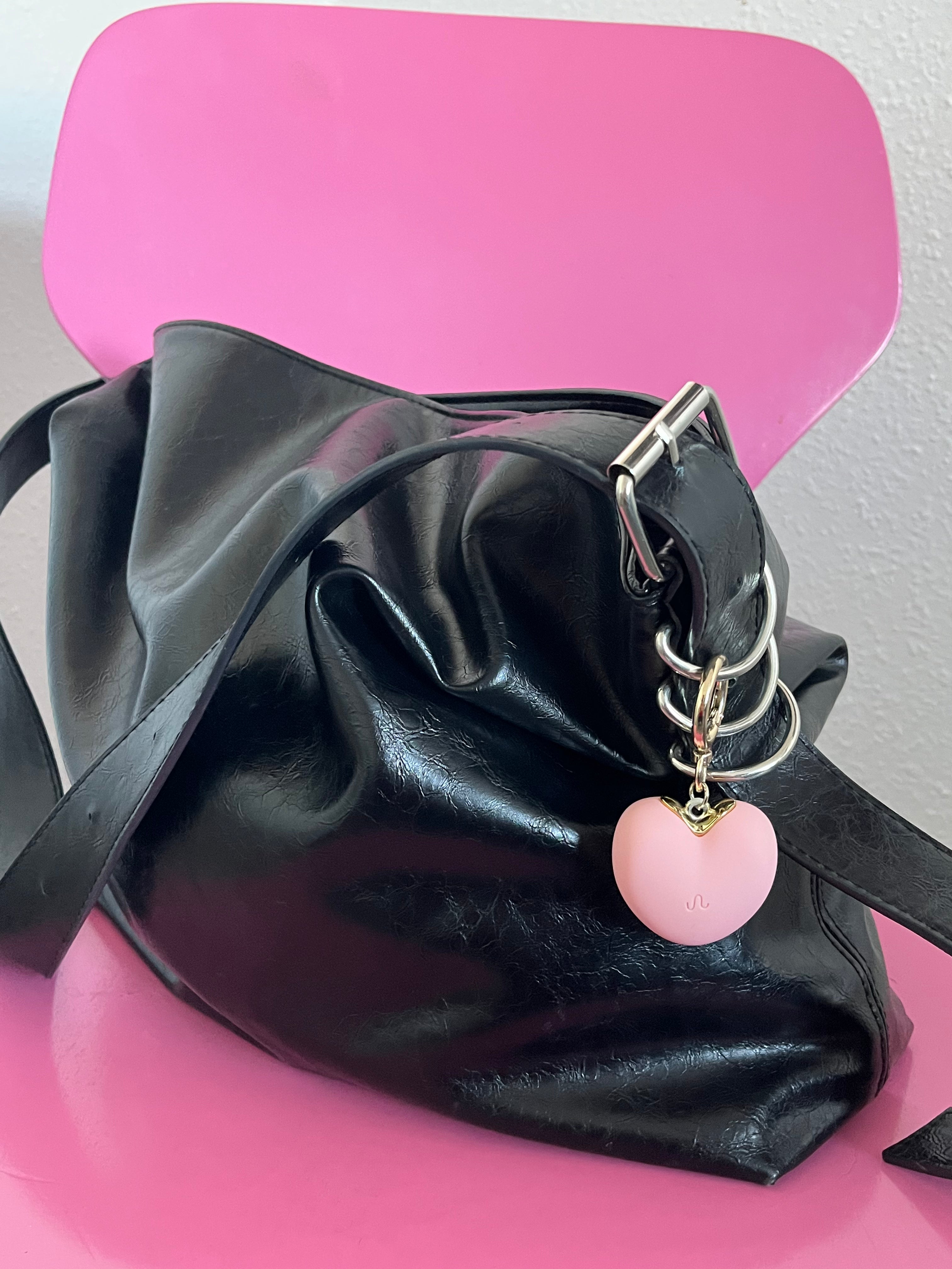 Lyserød Heart2Heart tryghedsnøglering på taske